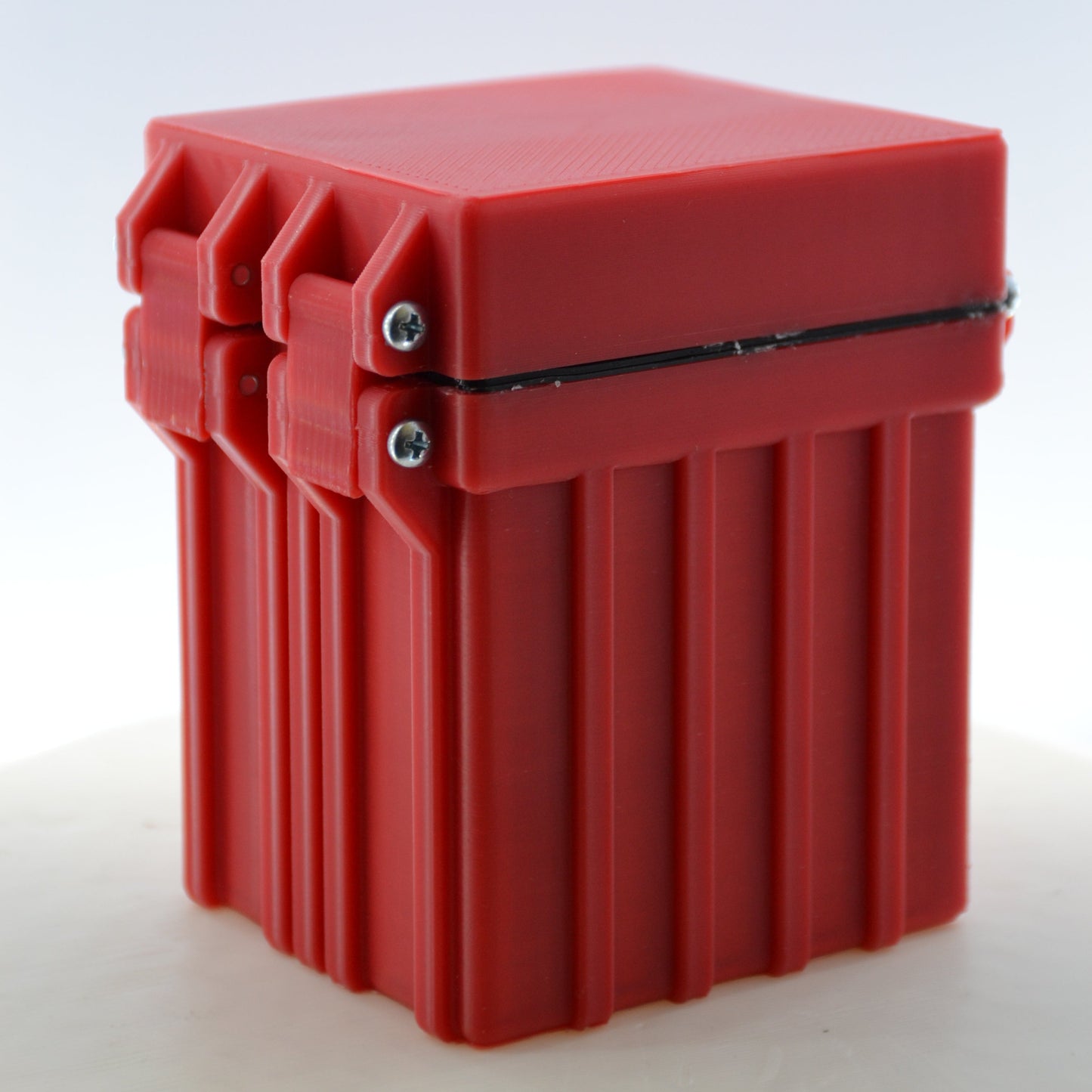 Red plastic deckbox on a white background